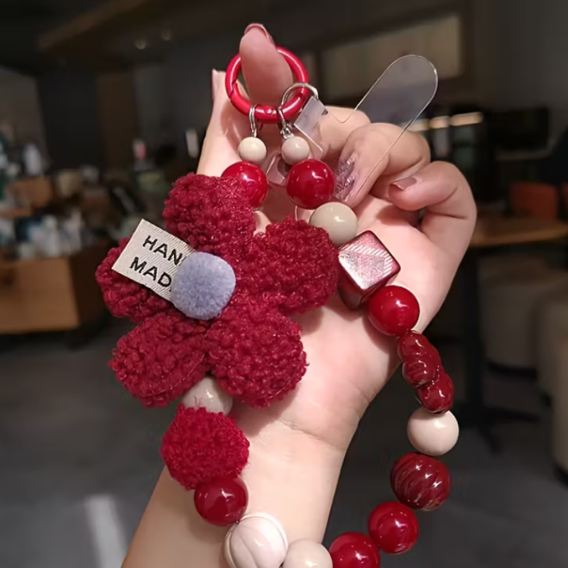 Correa para celular Bloom Red – diseño artesanal con flores y cuentas